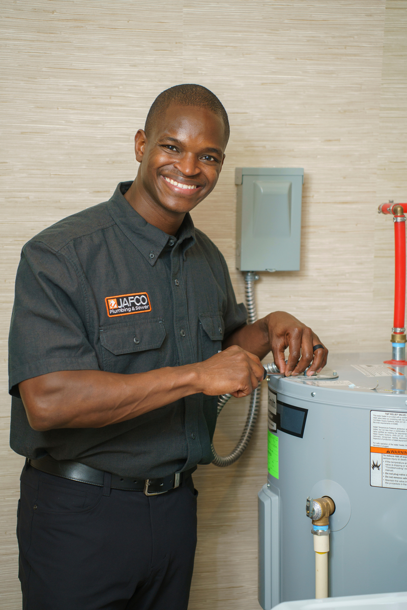 water heater installation tech installing a new unit